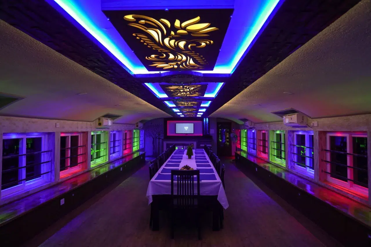 4-bedroom-upper-deck-hall-night-view View of Pournami Premium Houseboat Dining Hall during night - Day and Night Houseboat Package